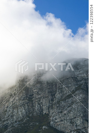 Tafelberg, close-up Table Mountain in big cloud, shrouded in fog, Cape Town, South Africa. Banner, natural landscape, blue sky 122398554