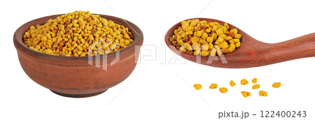 Bee pollen grains in ceramic bowl and wooden spoon isolated on white background 122400243