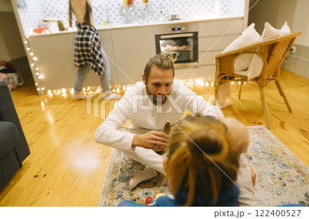 Family Time Enjoying Cozy Indoor Interaction Within a Modern Living Space Environment 122400527
