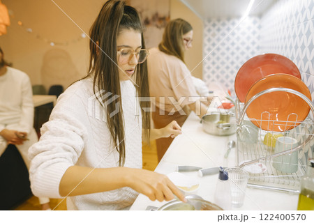 Cooking Together Embracing Culinary Creativity in a Cozy and Inviting Kitchen Setting 122400570