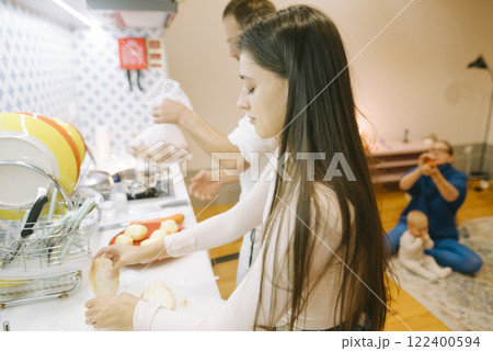 Family Kitchen Moments Cooking Together, Sharing Joy and Creating Lasting Memories 122400594