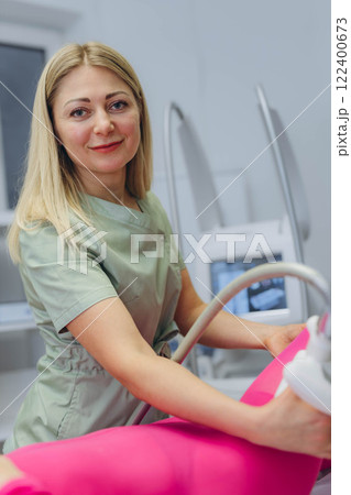 Lpg massage procedure. Hands of therapist holding lipomassage tool. Close up, selective focus. Lpg massage procedure. Hands of therapist holding lipomassage tool. Close up, selective focus. 122400673