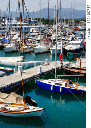 Port with boats in Antibes, summer day at the sea, white blue clouds Port with boats in Antibes, summer day at the sea, white blue clouds 122400715
