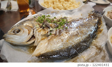 Savor the Delicious Grilled Fish Platter, a Culinary Delight with Fresh Accompaniments 122401431