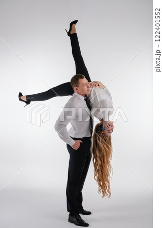 Couple performs an impressive dance lift showcasing athleticism and teamwork Couple performs an impressive dance lift showcasing athleticism and teamwork 122401552