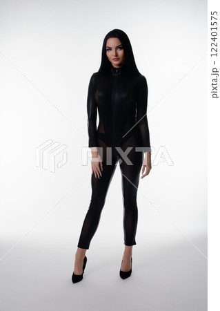 Elegant woman in stylish lingerie poses confidently in studio setting Elegant woman in stylish lingerie poses confidently in studio setting 122401575