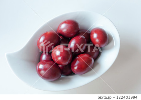 Traditional red easter eggs. Chicken eggs are painted red Traditional red easter eggs. Chicken eggs are painted red 122401994