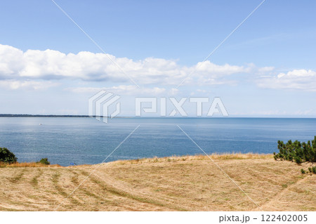 Natural and sea landscape. Beautiful beach blue sea water. Blue sky background. Sea skyline 122402005