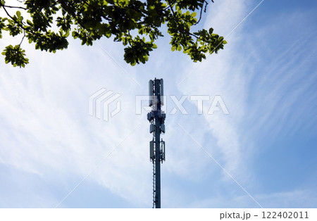 Cellural antenna and telecommunications tower. Mobile phone base station. Cellural antenna and telecommunications tower. Mobile phone base station. 122402011