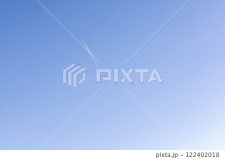 A single jet plane flying on the beautiful blue sky 122402018