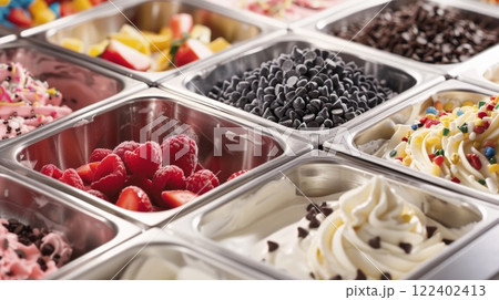 A selfserve frozen yogurt machine with options for toppings such as sprinkles chocolate chips and fresh fruit 122402413