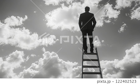 Successfull businessman reaching the top. Man climbing up a ladder 122402523