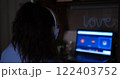 Capture the essence of empowerment as woman freelancer engages in virtual conference via Google Meet comfort of her home selective focus convey professionalism determination in remote work culture 122403752