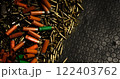 Spent brass casings of various calibers mixed gunpowder black rubber floor the aftermath of intense target practice ammunition gritty reality of shooting sessions shooting ranges firearm training. 122403762