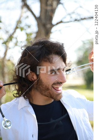 Happy Long Hair Doctor Dancing Music In The Park Outside The Hospital 122404130