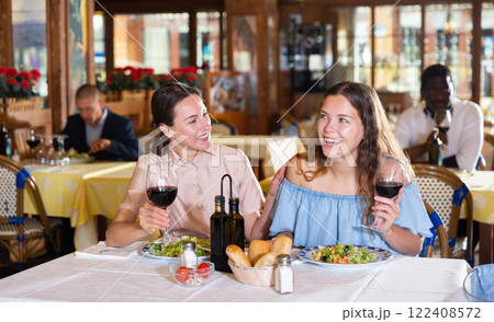 Couple enjoying dinner with wine at restaurant Couple enjoying dinner with wine at restaurant 122408572