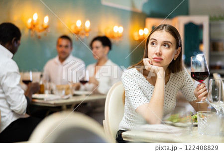 Sad lady at the restaurant table Sad lady at the restaurant table 122408829