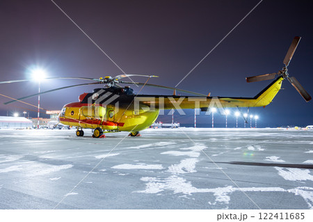 Medical helicopter on winter airport apron at night 122411685