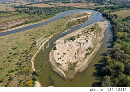 Aerial view of a huge sand riverbank island on a river 122412815
