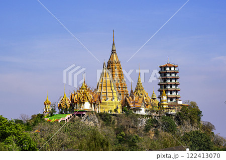 View of Wat Tham Sua, the beautiful buddhist temple on top of the mountain. View of Wat Tham Sua, the beautiful buddhist temple on top of the mountain. 122413070