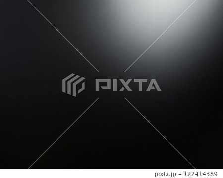 Dark Background with a Subtle Glowing Spotlight 122414389