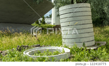 reinforced concrete sewer rings are stacked 122418773