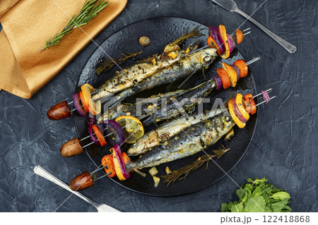 Fish and vegetable skewer in barbecue grill. 122418868