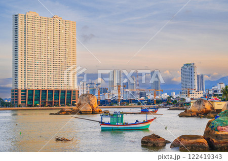 View of the Kei River with fishing boats against the backdrop of Urban view in north district of Nha Trang city, Vietnam 122419343