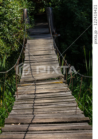 Suspension bridge, walkway to the adventurous, cross to the other side Suspension bridge, walkway to the adventurous, cross to the other side 122419421