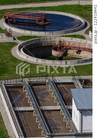 Water treatment facility utilizing circular tanks for purification and filtration processes in an industrial area Water treatment facility utilizing circular tanks for purification and filtration processes in an industrial area 122419441