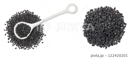 black sesame seeds in ceramic spoon isolated on white background. Top view. Flat lay black sesame seeds in ceramic spoon isolated on white background. Top view. Flat lay 122420201