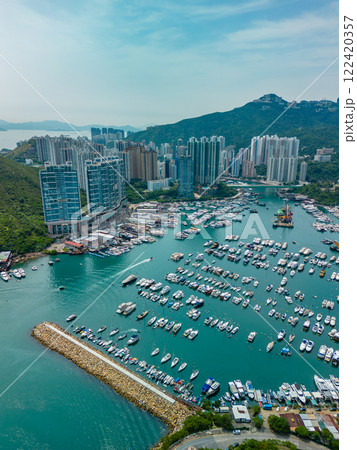 Vertical aerial view of apartment buildings and marina in Hong Kong 122420357