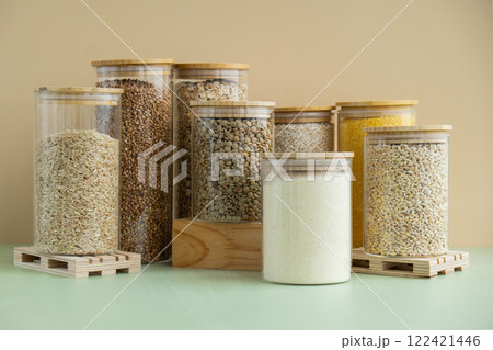 Set of Raw porridges in sustainable packaging. Refillable systems of packaging. Gluten free cereals. Health gut benefits. Concept of alternative whole spelt grain ingredient. Vegetarian diet recipes 122421446