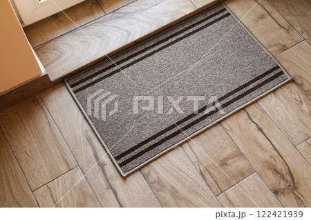 Door Mat Entryway. Outdoor Mat. Mock up Entry Mat. Wooden Brown floor. Top View 122421939