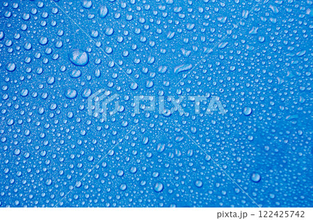 Top view of water droplets with light blue color background suitable for wallpaper. water droplets concept 122425742