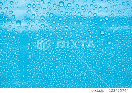 Top view of water droplets with blue color background suitable for wallpaper Top view of water droplets with blue color background suitable for wallpaper 122425744
