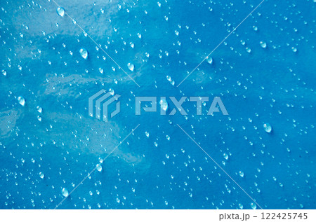 Top view of droplets with blue color background suitable for wallpaper Top view of droplets with blue color background suitable for wallpaper 122425745