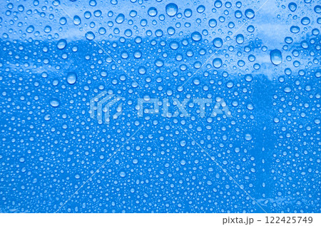 Top view of water droplets with blue color background suitable for wallpaper. Top view of water droplets with blue color background suitable for wallpaper. 122425749