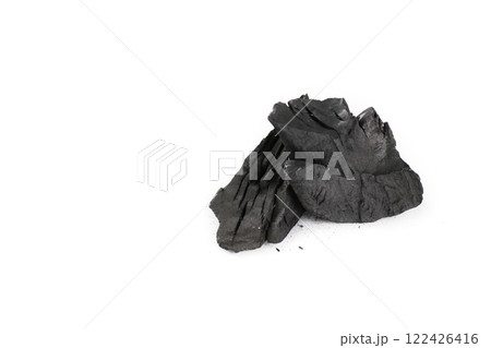 Isolated pieces of black charcoal resting on a clean white background, showcasing its rough texture and deep, rich color. Often used for grilling, art, and filtration, charcoal symbolizes both energy Isolated pieces of black charcoal resting on a clean white background, showcasing its rough texture and deep, rich color. Often used for grilling, art, and filtration, charcoal symbolizes both energy 122426416