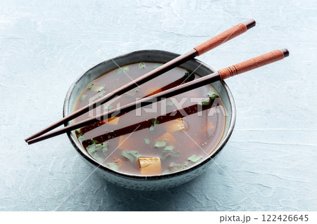 Tofu soup, Japanese cuisine. Miso soup with bean curd and green onions Tofu soup, Japanese cuisine. Miso soup with bean curd and green onions 122426645