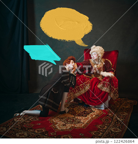 Young man, court servant in red wig sitting next to elderly woman, medieval empress against dark background with abstract speech bubbles. Communication. Young man, court servant in red wig sitting next to elderly woman, medieval empress against dark background with abstract speech bubbles. Communication. 122426864