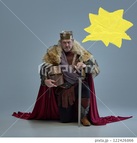 Art collage. Medieval king in golden crown, fur-lined cloak, and armor on grey background with yellow speech bubbles for text placement. Art collage. Medieval king in golden crown, fur-lined cloak, and armor on grey background with yellow speech bubbles for text placement. 122426866