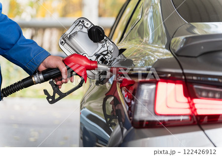 Refueling a Car at Gas Station. Close-Up of Red Nozzle. Refueling a Car at Gas Station. Close-Up of Red Nozzle. 122426912