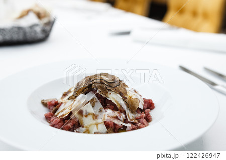 Veal tartare with truffle served on a plate Veal tartare with truffle served on a plate 122426947