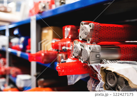Colored warehouse racks for storing pneumatic cylinders for the production of factory machines and equipment. 122427175