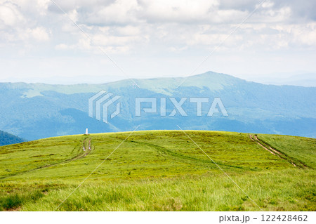 alpine meadow of mountain smooth in summer. spectacular highland wallpaper. cloudy weather. watershed ridge of ukrainian carpathians in the distance. landscape with wide open vista alpine meadow of mountain smooth in summer. spectacular highland wallpaper. cloudy weather. watershed ridge of ukrainian carpathians in the distance. landscape with wide open vista 122428462