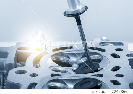 The intake and exhaust vale assembly process by robotic system in the light blue scene. The intake and exhaust vale assembly process by robotic system in the light blue scene. 122428662