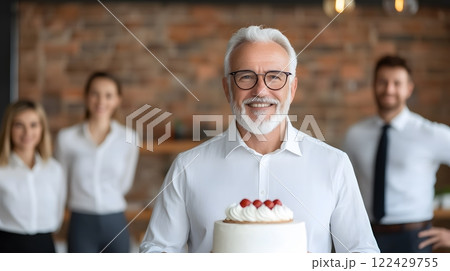 Retiree cutting a retirement cake while surrounded by coworkers and family in a vibrant setting 122429755