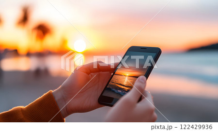 Finger pressing smartphone mockup during sunset, colorful horizon as backdrop 122429936
