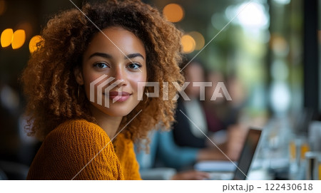 Marketing team discussing strategies around a large table with laptops and digital tablets, dynamic brainstorming session, charts on screens Marketing team discussing strategies around a large table with laptops and digital tablets, dynamic brainstorming session, charts on screens 122430618